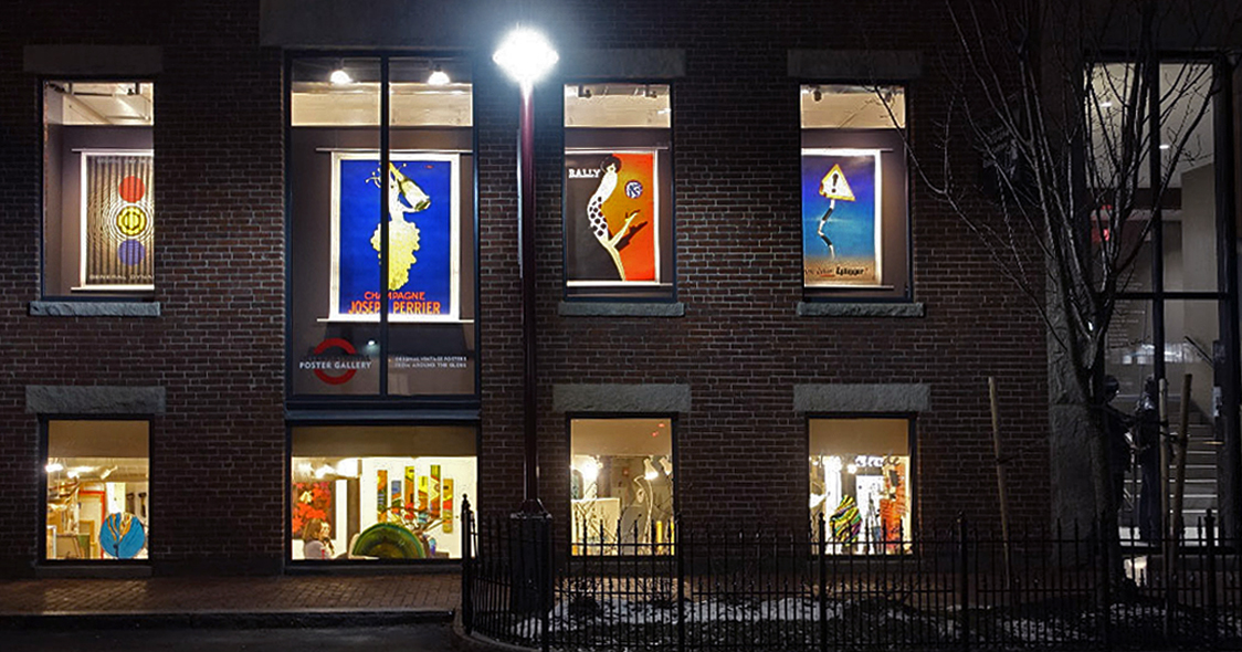 External view of gallery showing posters at night