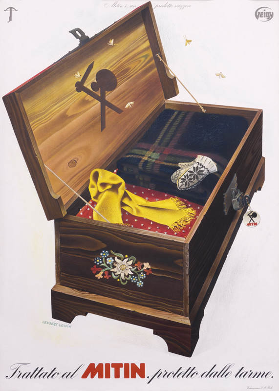 Wooden chest with stored sweaters, blankets, a scarf and pair of gloves; brown, red, black, yellow, blue and white