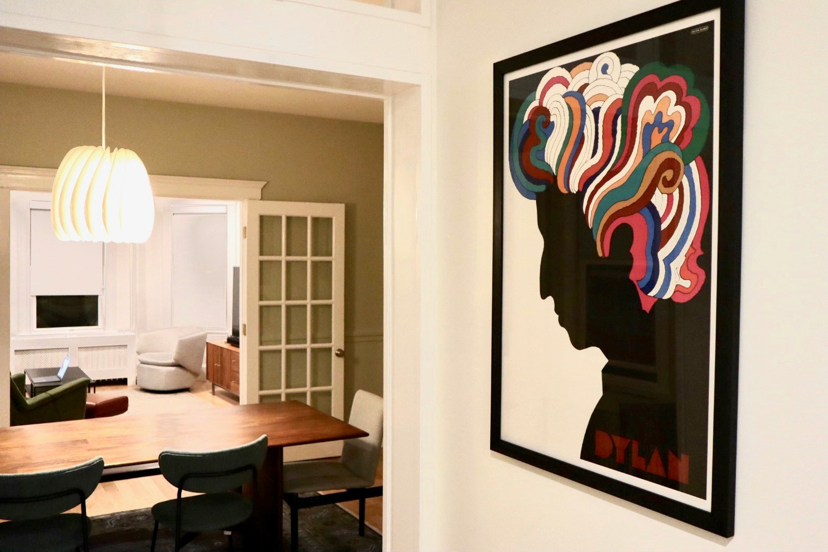 Poster of Dylan on wall facing dining room and living room