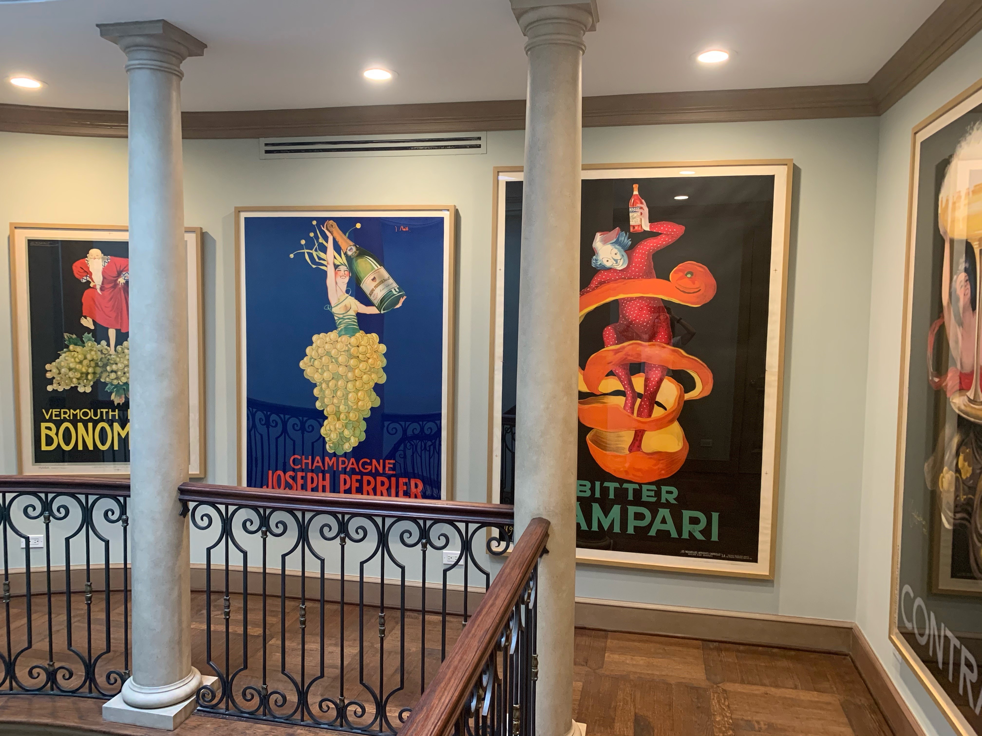 four framed large posters on upstairs landing